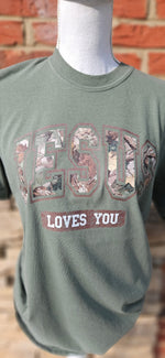 Load image into Gallery viewer, Camo Jesus Loves You on Comfort Colors
