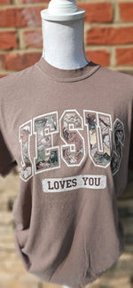 Load image into Gallery viewer, Camo Jesus Loves You on Comfort Colors

