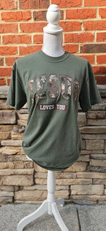 Load image into Gallery viewer, Camo Jesus Loves You on Comfort Colors

