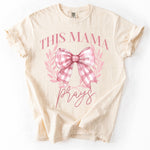 Load image into Gallery viewer, This Mama Prays Coquette Bow on Comfort Colors (Shown on Ivory)
