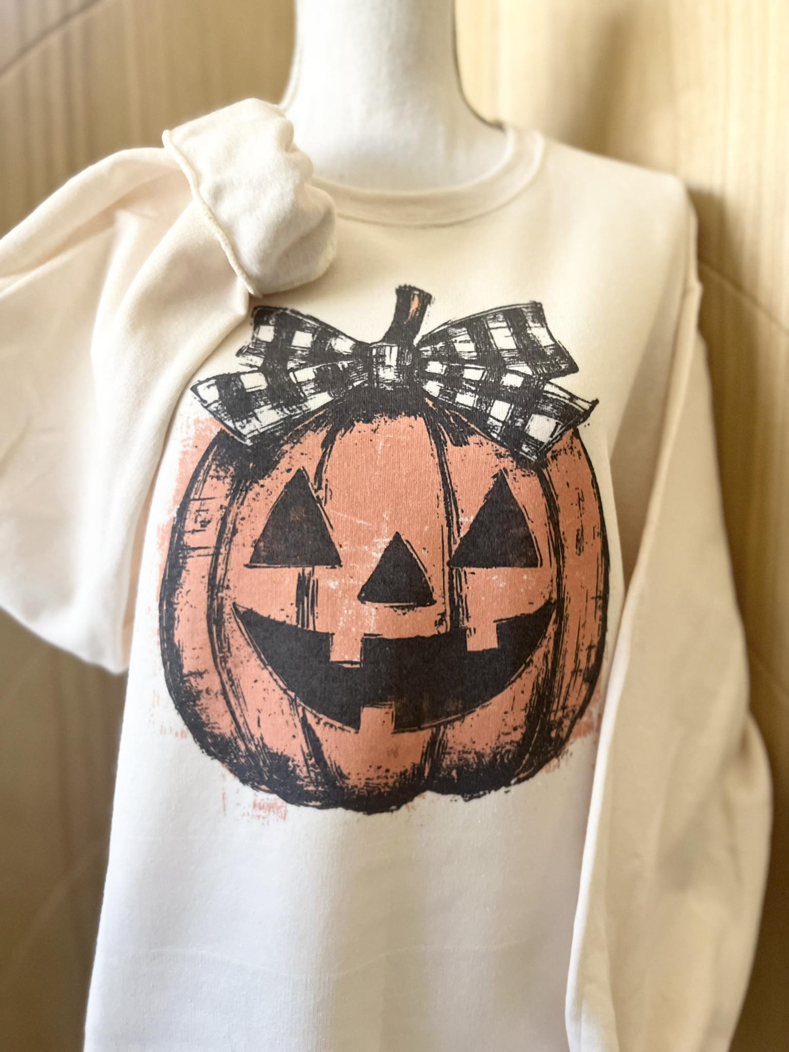 Jack-o-Lantern with Black/White Gingham Bow Sweatshirt on Cream