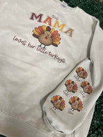 Load image into Gallery viewer, This Mama Loves Her Little Turkeys Customizable Sweatshirt with Optional Names on Sleeve on Sand

