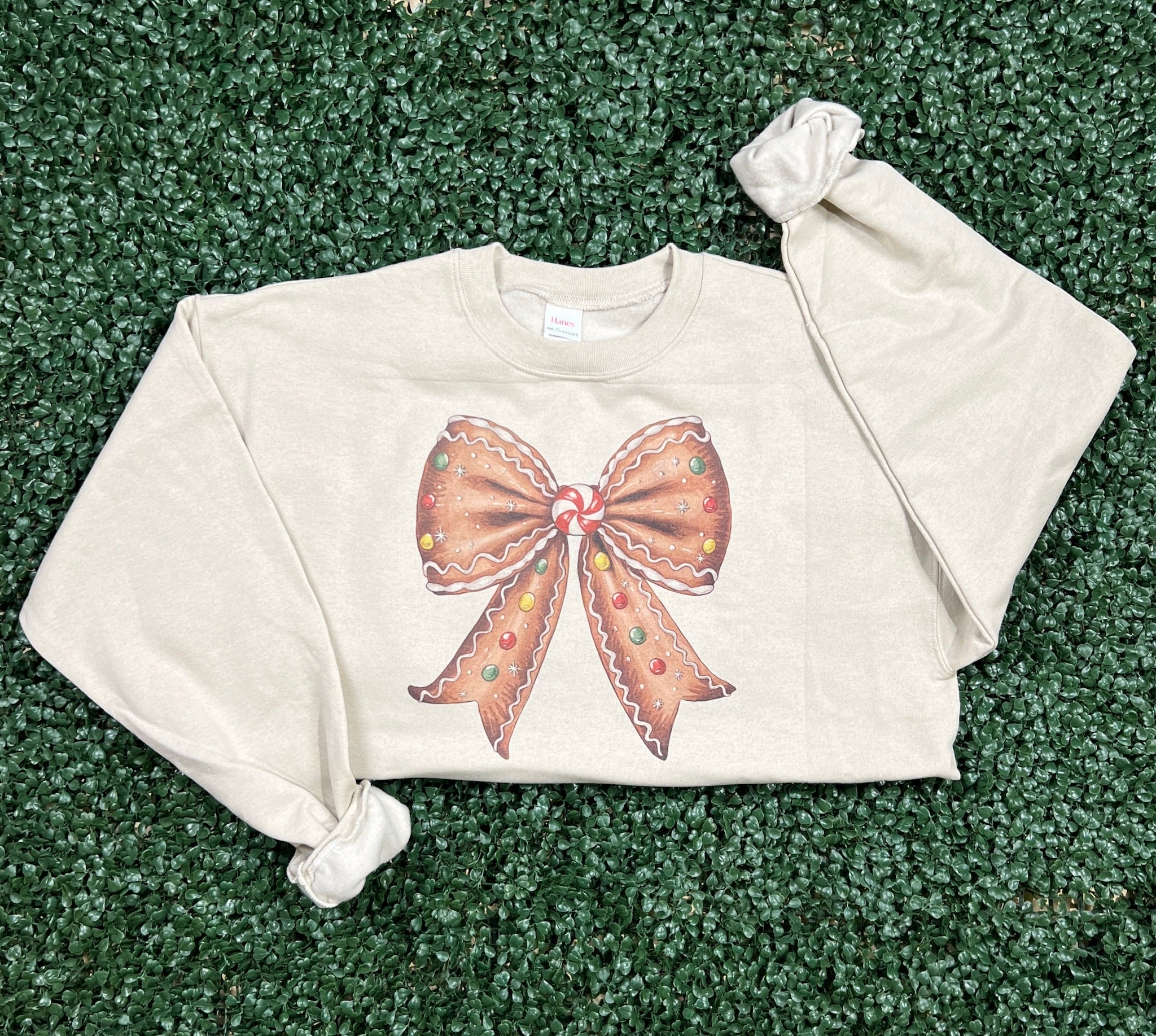 Gingerbread Bow Sweatshirt on Sand