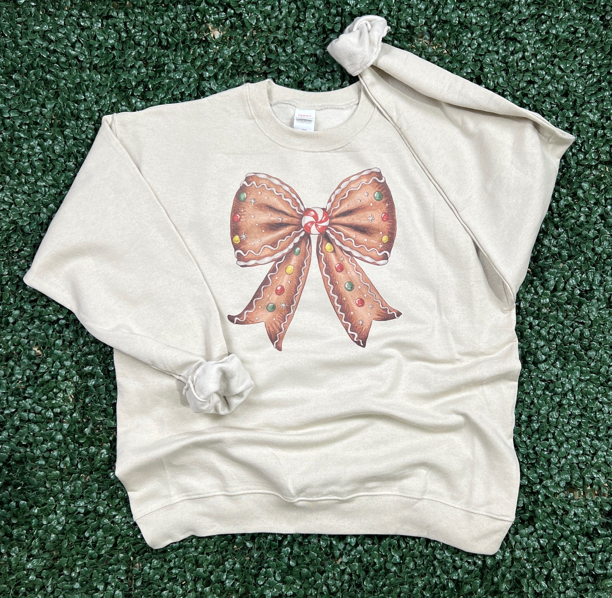 Gingerbread Bow Sweatshirt on Sand