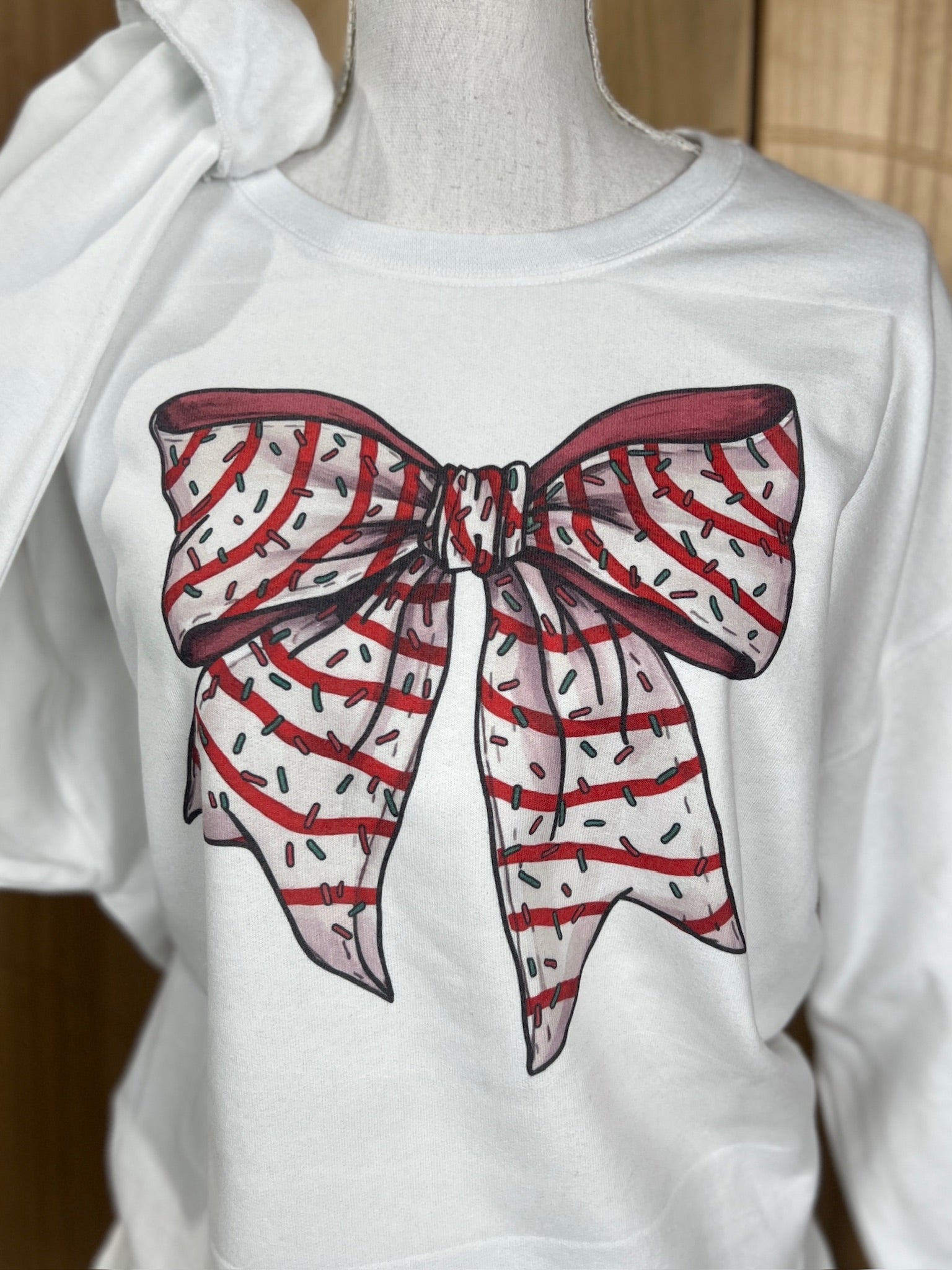 Christmas Tree Cake Bow Sweatshirt on White