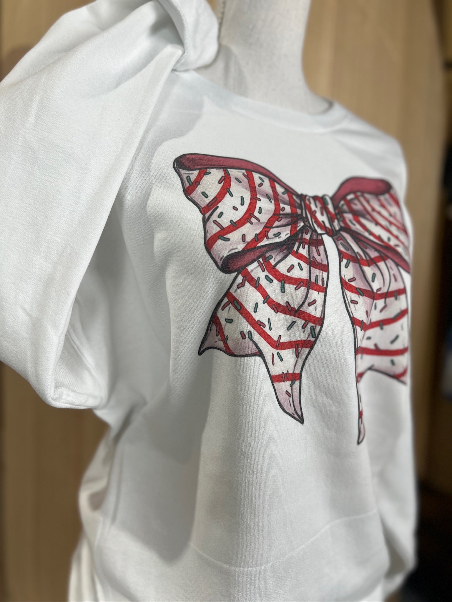 Christmas Tree Cake Bow Sweatshirt on White