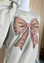 Load image into Gallery viewer, Gingerbread Bow Sweatshirt on Sand
