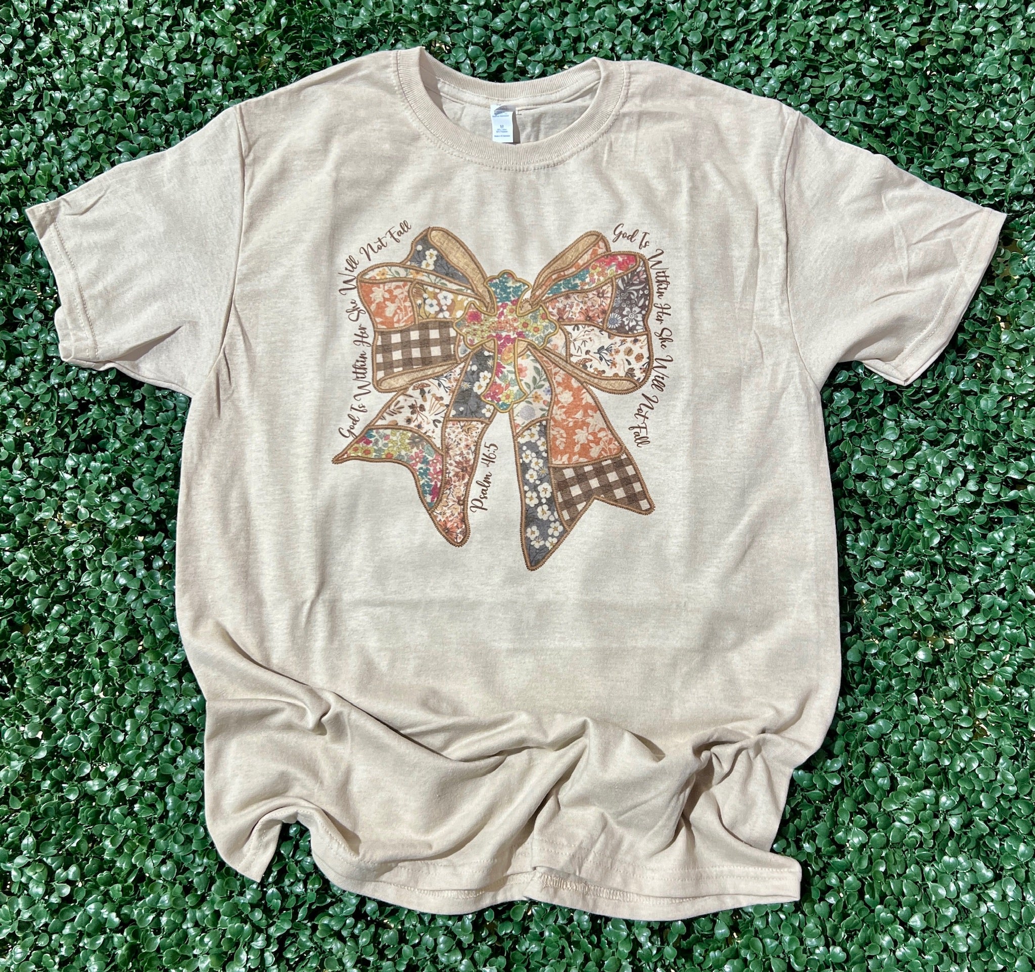 God Is Within Her Patchwork Bow on Sand