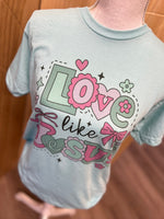 Load image into Gallery viewer, Love Like Jesus Pink and Green Hearts on Heather Purist Blue
