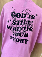 Load image into Gallery viewer, Front/Back God Is Still Writing Your Story on Gildan Softstyle Heather Radiant Orchid
