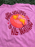 Load image into Gallery viewer, Go Make Disciples Of All Nations Pink Text on Gildan Softstyle Heather Radiant Orchid
