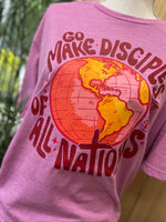 Load image into Gallery viewer, Go Make Disciples Of All Nations Pink Text on Gildan Softstyle Heather Radiant Orchid
