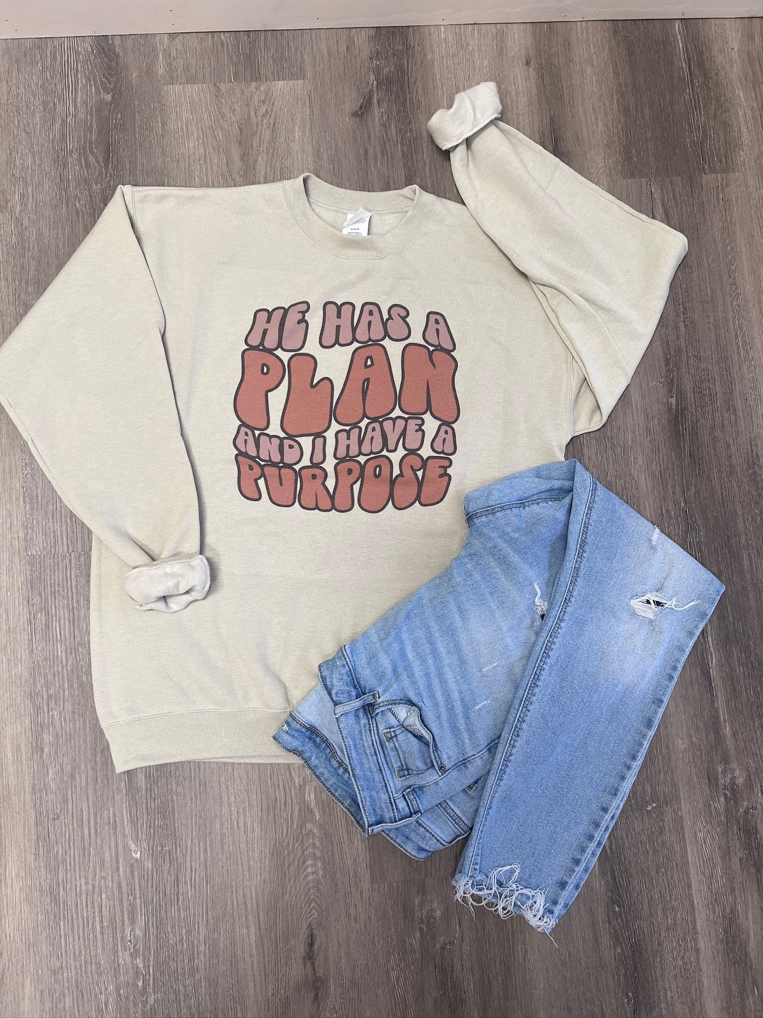He Has A Plan Sweatshirt on Sand