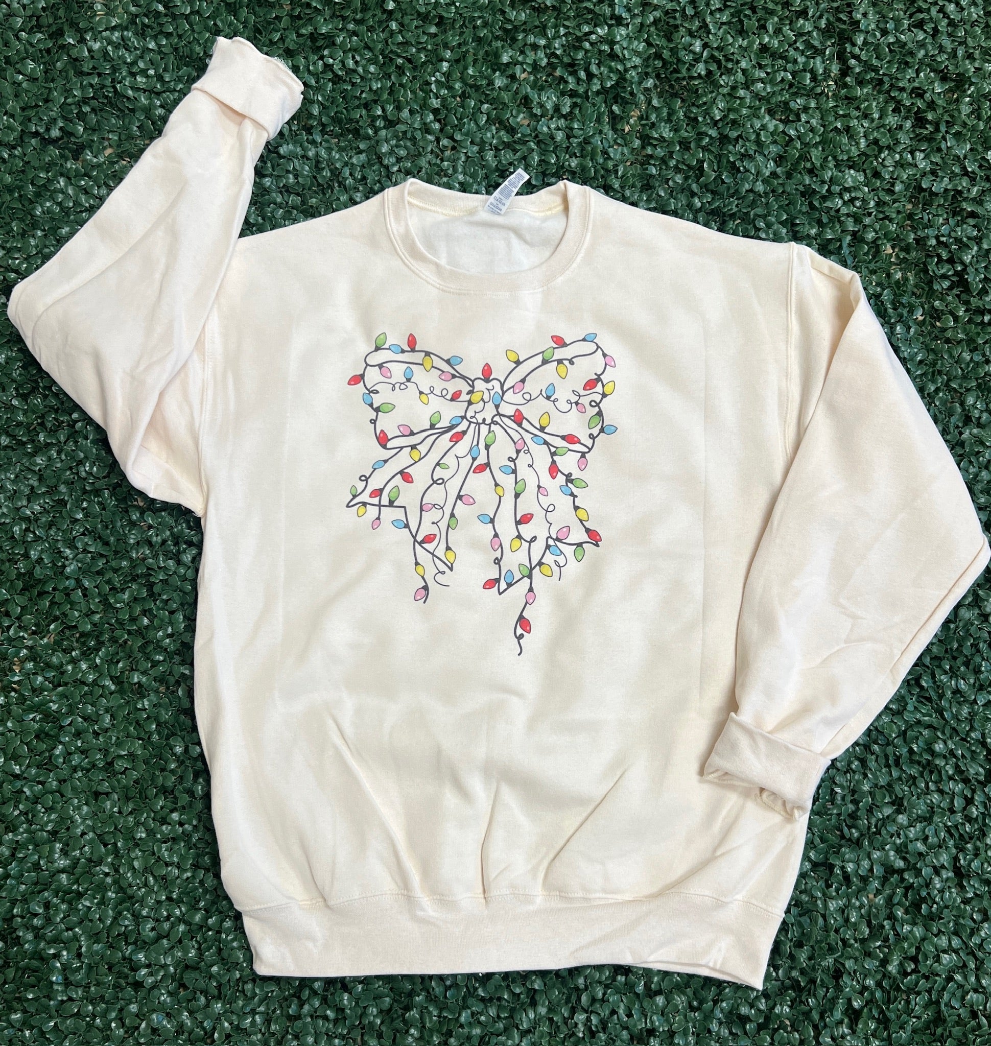 Christmas Lights Bow Sweatshirt on Cream