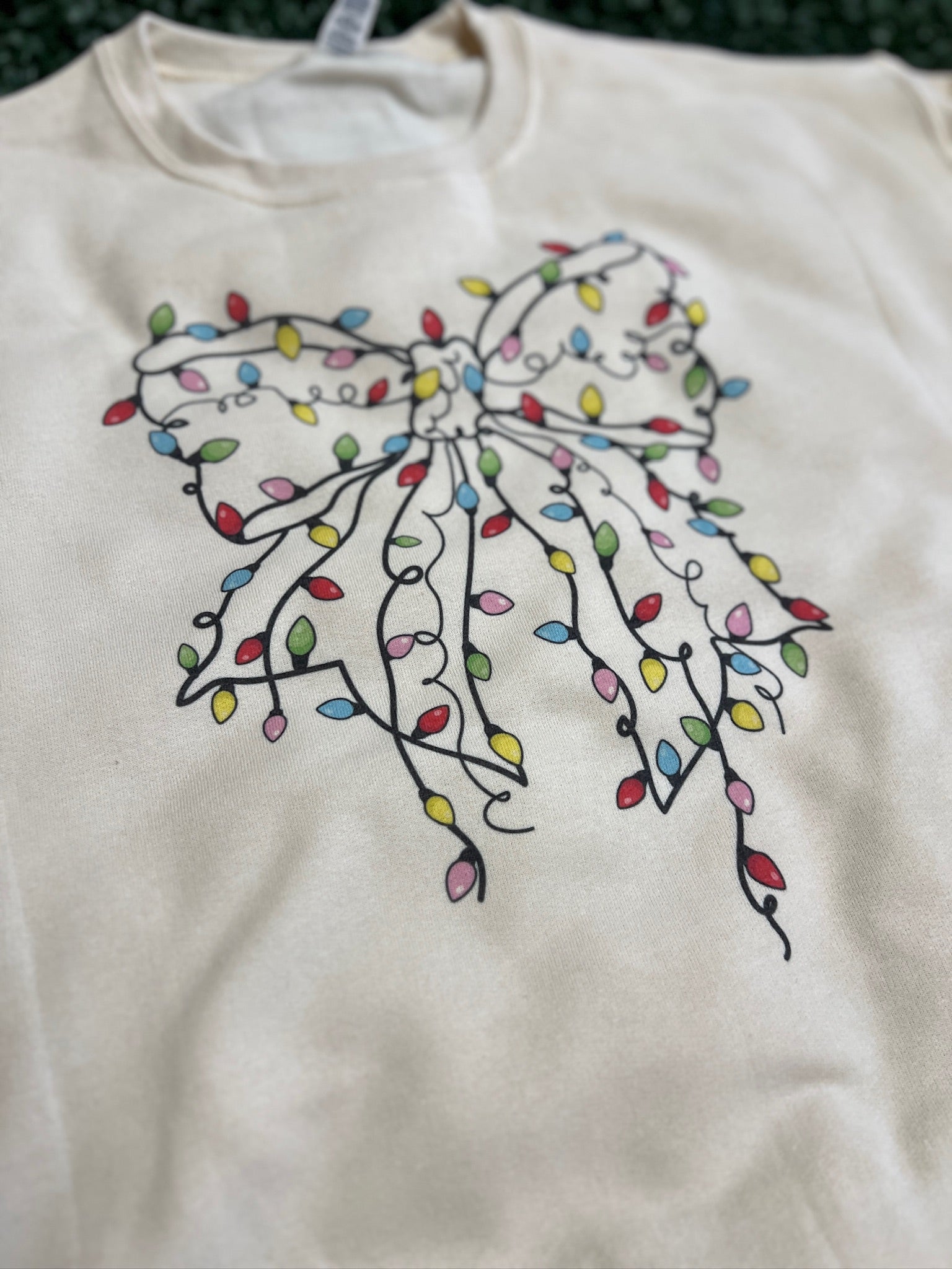 Christmas Lights Bow Sweatshirt on Cream