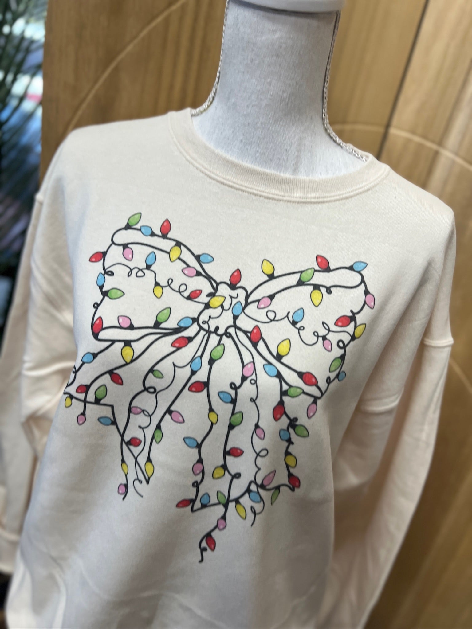Christmas Lights Bow Sweatshirt on Cream