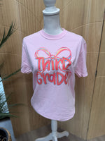 Load image into Gallery viewer, Preppy Bow Grade Level Tees on Comfort Colors (Shown on Blossom)
