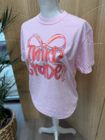 Load image into Gallery viewer, Preppy Bow Grade Level Tees on Comfort Colors (Shown on Blossom)
